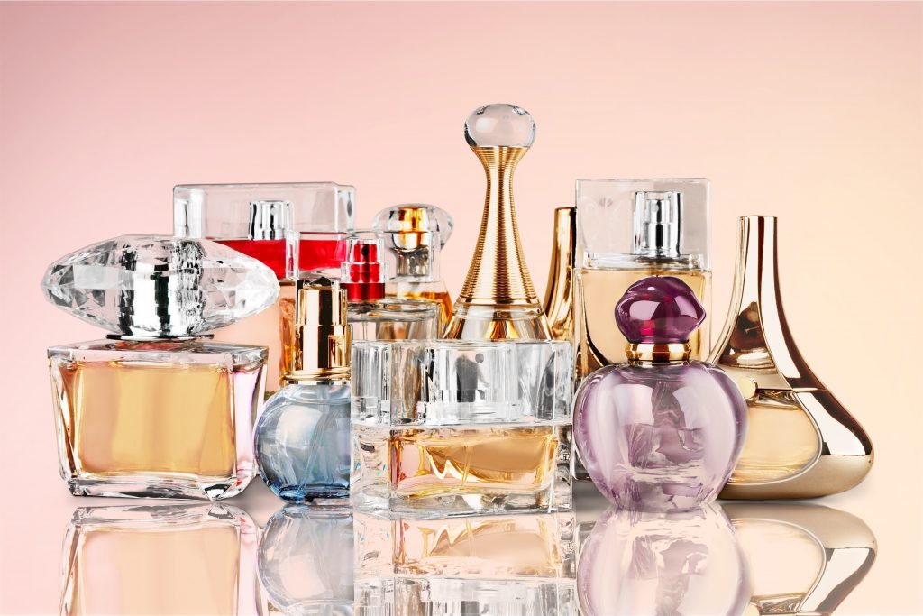 Aromatic Perfume bottles on background